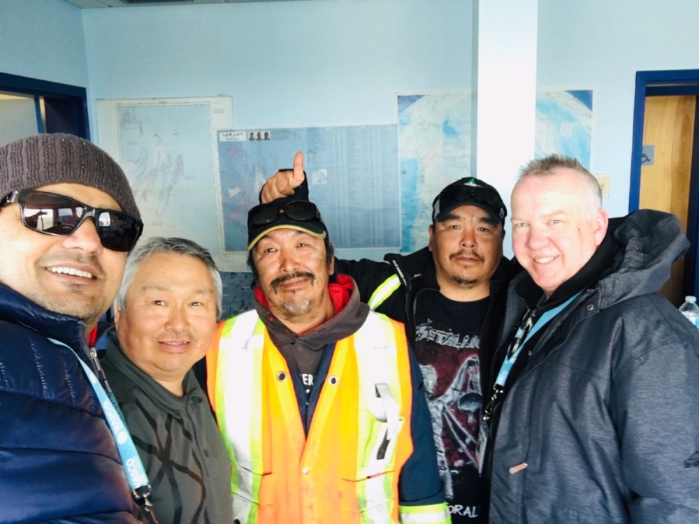 WASCO employees take a group selfie with airport partners at Sanikluaq.