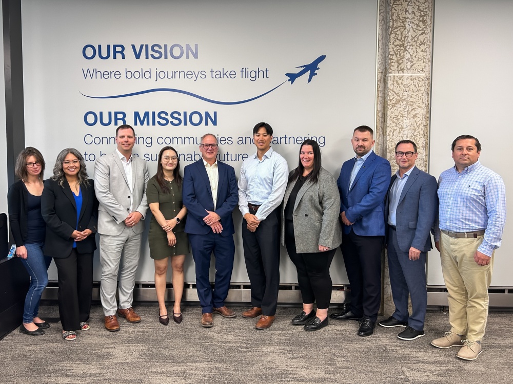 Ten WASCO employees stand for a group photo in the office in Winnipeg.