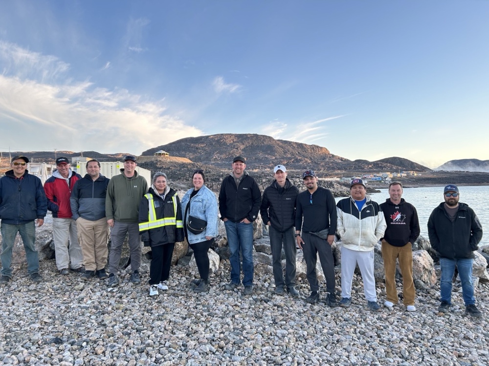 WASCO employees take a group photo with airport partners in Kinngait.